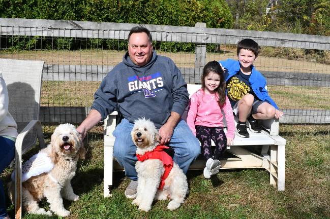 Vernon Dog Park hosts contest, parade <b>Ron Scrudato is shown with his children, Peyton and Parker and their dogs, Xienna and Ginger.</b>