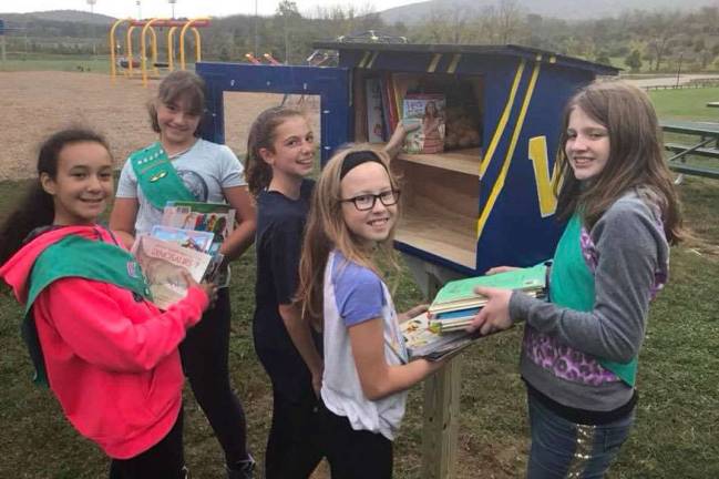 Girl Scouts create library at park