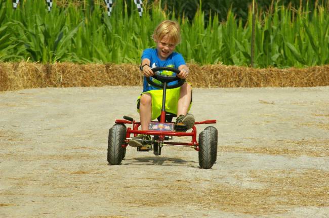 Theo Peirce, 7, of Sparta tries out the pedal-cart track at Heaven Hill Farm. He came to the farm with his mom after she saw a billboard about the Action Fun Farm on Route 23.