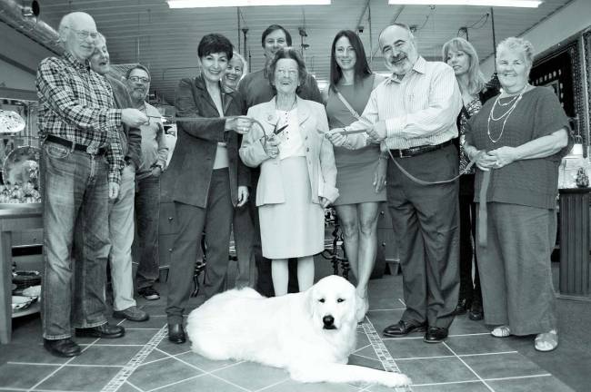Handcrafted elegance comes to Hardyston From left: employee John Goleski, Jerry Fincke, Randy DeMarcado, owner Susan Ghorbanian, Susanne Lerescu of Crystal Springs Resort, landlord Pat Barrett, Hardyston Deputy Mayor Leslie Hamilton, landlady Karen Barrett, owner Bruce Ghorbanian, Cecelia Fincke, and employee Chris Risano. Quincy the Polish Tatra is front and center.