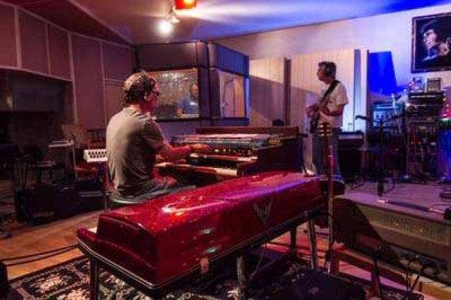 Musicians John Ginty and Paul Kusik in studio.