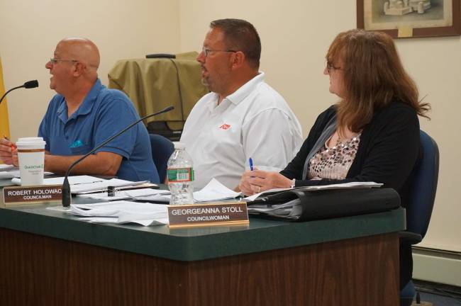Sussex Borough puts off DPW resolution Councilman Mario Poggi and Robert Holowach and Councilwoman Georgeanna Stoll discusses bringing the DPW inhouse.