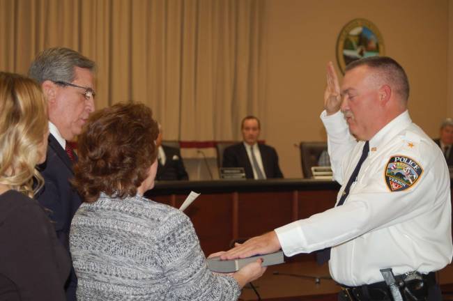 Vernon swears in 4th police chief in township history Photo by Mike Zummo Vernon's new police chief Arthur Randy Mills is sworn into his position by township mayor Victor Marotta, left, as his wife, Irene, holds the Bible at the Nov. 14 Township Council meeting.