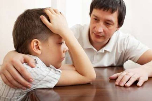 Children feel holiday stress too Father comforts a sad child. Problems in the family