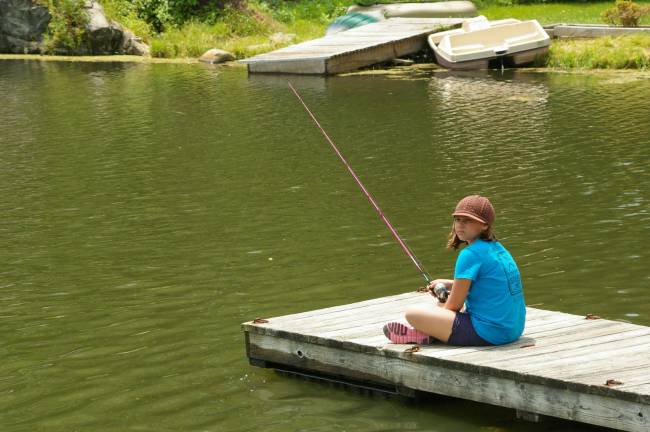 Vanessa Cefaloni, 9, fishes from the dock.