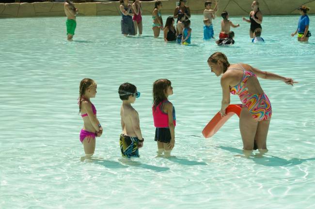 Certified Water Safety Instructor Ingrid Aldridge of Lake Hopatcong helped young girls with their first swimming lessons and taught them to be be relaxed as they floated in the Hightide Wavepool at Action Park.