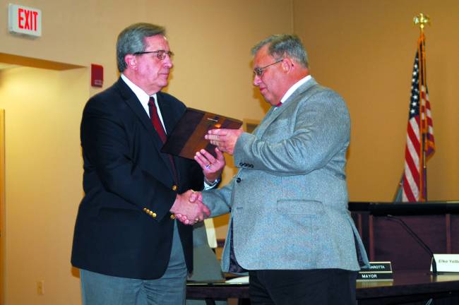 Vernon swears in 4th police chief in township history Photo by Mike Zummo Former Vernon township police chief Roy Wherry is presented with a plaque commemorating his years of service by township mayor Victor Marotta at the Nov. 14 Township Council meeting.