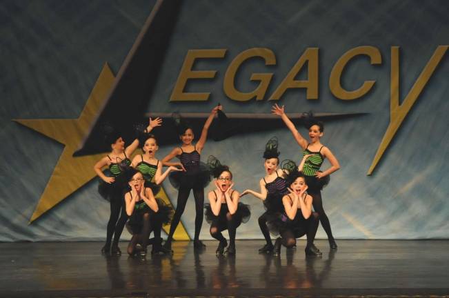 Dance Expression earns high scores at Legacy competition "Ding Dong the Witch is Dead" is performed.