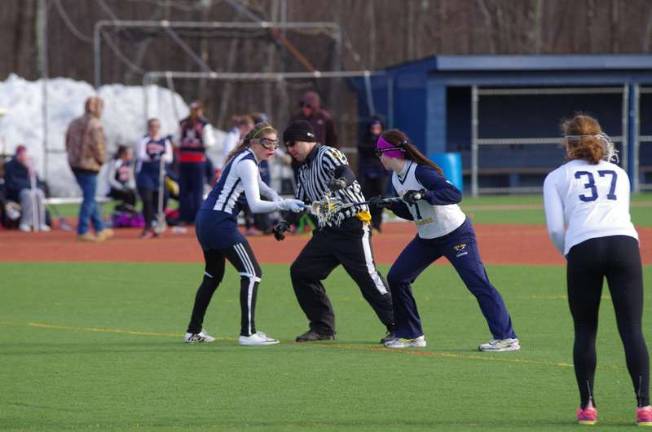 Scrimmages held for area lacrosse, softball teams A referee sets junior varsity players for action. Pope John XXIII High School in Sparta, New Jersey hosted North Warren Regional High School for lacrosse scrimmages on Monday, March 24, 2014. The girls varsity and junior varsity teams participated.