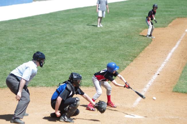 The Kittatinny catcher is ready as the Sussex-Wantage batter swings low.