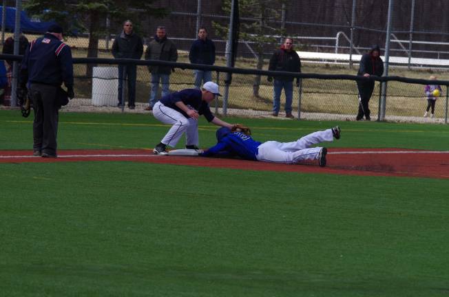 A Northern Valley runner beats the throw to third. Pope John XXIII High School beat Northern Valley Regional High School (Demarest, N.J.) in boys varsity baseball on Saturday, April 5, 2014. The final score was 6-1. The game was played at Pope John XXIII High School in Sparta Township, New Jersey.