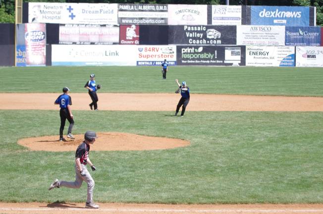 Little League season finishes on Sunday Kittatinny in the field as a Sussex-Wantage runner moves towards first base.