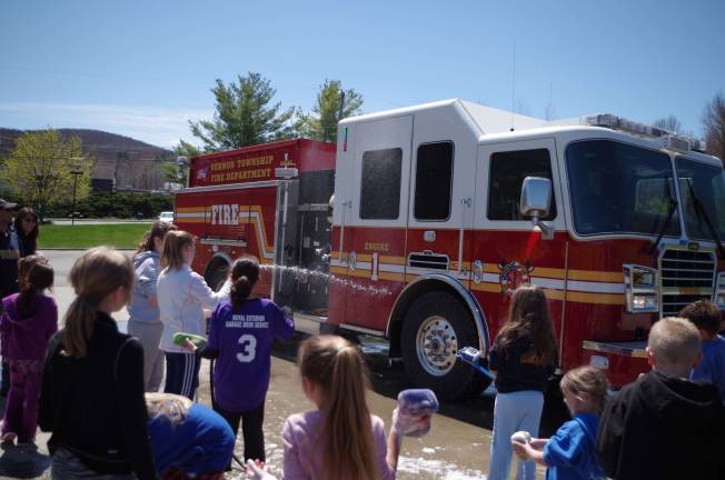 Vernon softball team hosts fundraiser Engine 1 of the Vernon Township Fire Department gets washed at the fundraising car wash held by the Vernon Girls Softball League.