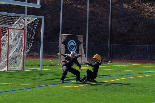 A Sussex runner reaches third base before the ball does. Sussex County Technical High School took on Newton High School in girls varsity softball on Saturday, March 22, 2014. The scrimmage was played at Newton High School in Newton, New Jersey.