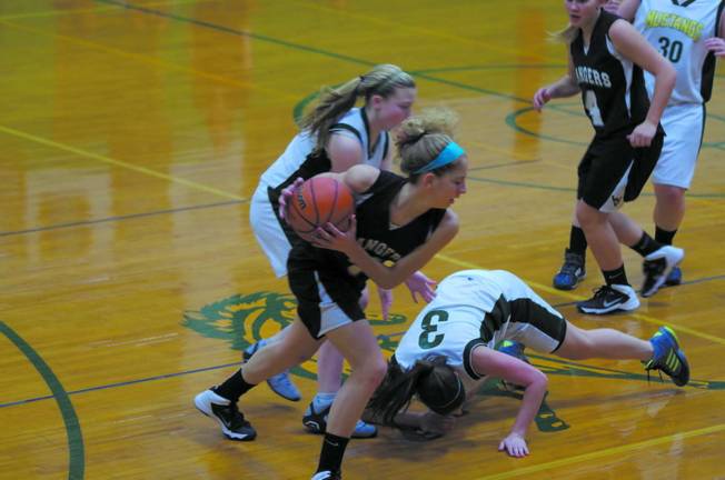 Lady Rangers top Sussex Tech, 49-24 Wallkill Valley's Brittany Todd grabs the ball after Sussex County Tech's Leann Kazawic (3) loses it.
