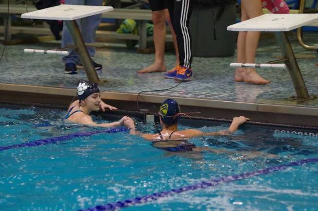 Area schools take part in swim meet Kittatinny and Jefferson Township high school swimmers shake hands after a race.
