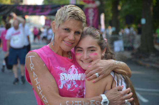 Local uses running to help in her battle against cancer Hamburg local, Catherine Stone, uses her running to help give her the courage to battle breast cancer. Stone, pictured with her daughter Talia Jean, is seen at the Race for the Cure in New York City.