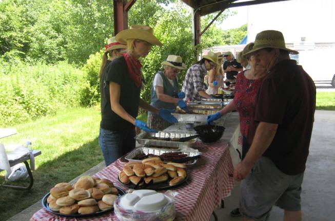 Barbecue held for Vernon seniors Servers and guests did it up country style.