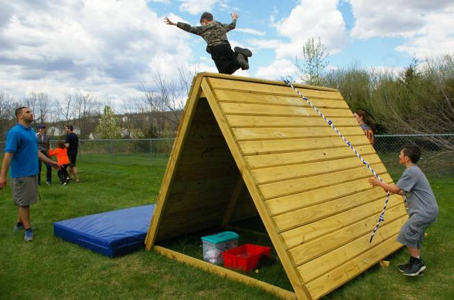 The afternoon included giving kids the chance to test their fitness prowess in a boot camp-style obstacle course with tires, tunnels, balance beams, a crawling area, and a slanted climbing wall.