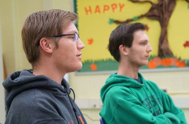 Matthew Kubik, on left, discusses a $200 fine for vaping on high school property. Michael Kubik listens on right.