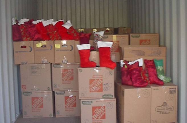 Cartons of Christmas stockings await shipment to US servicemen and women who are deployed throughout the globe.