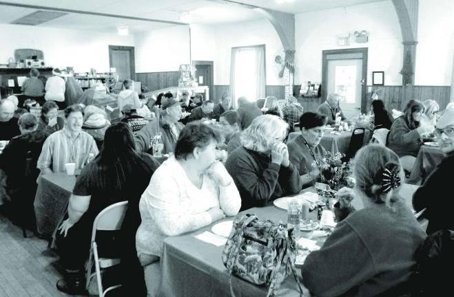 Church hosts third annual Christmas dinner Photo by Viktoria-Leigh Wagner Attendees eat at the third annual Christmas Dinner held by the United Methodist Church.