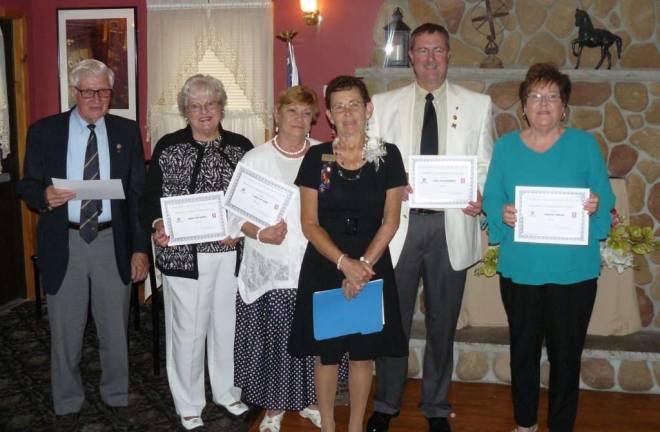 Wallkill Valley Rotary Club President Sharon Hosking presents certificates of perfect attendance for the past Rotary year to, from left, Kenneth Meredith, Mary Ann Seeko, Carolyn King, Paul Katterman, and Sharon Walsh.