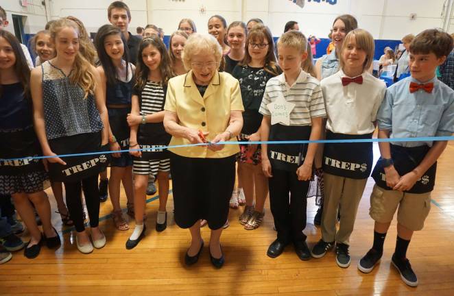 Photos by Vera Olinski Former Mayor and current Sussex Borough Councilwoman Katherine Little cuts the ribbon for the grand opening of the TREP$ Marketplace on Wednesday, May 6, at Sussex Middle School.
