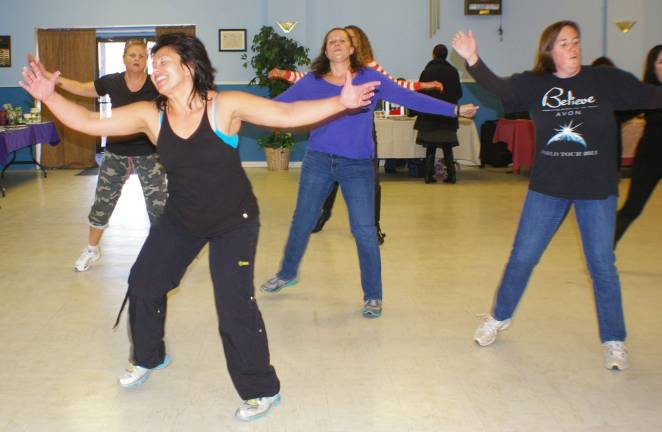 Sparta resident Samantha LeValley is shown leading about 10 ladies through a series of Zumba aerobic exercises.