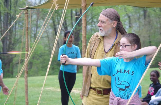 In frontiersman garb, Doug Siedenburg of Califon taught archery basics to the kids and each one had a chance to shoot at a target.