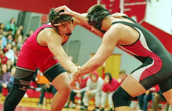 At left High Point's Hunter Flores takes on Westwood's Tyler Myack in the 195 lbs match.