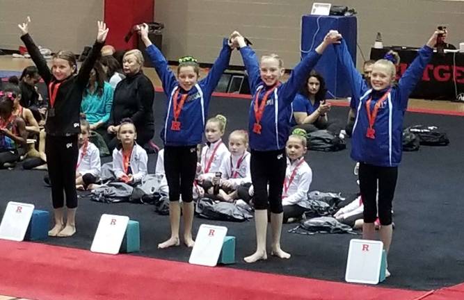 Giant Gymnastics performs well at Rutgers Color Games Lilly Gretkowski, Emma Hamilton and Brook Selander of Sparta go 1-2-3.
