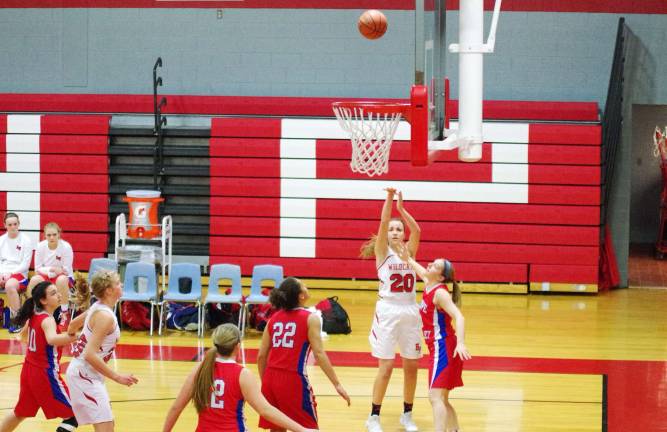 High Point Wildcat Margo Peterson launches a long shot while covered by Lenape Valley Patriot Alycia Cahn. Peterson scored a game-high 22 points and had seven rebounds, three steals and three blocks.