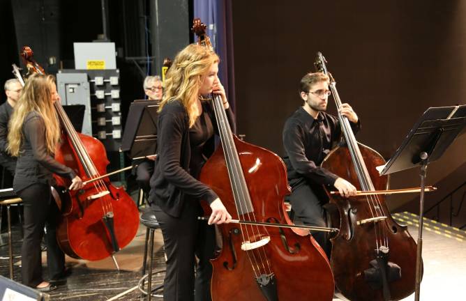 Vernon high school orchestra rehearses with pros Katie Sherman and Erin Kenely on Double Bass