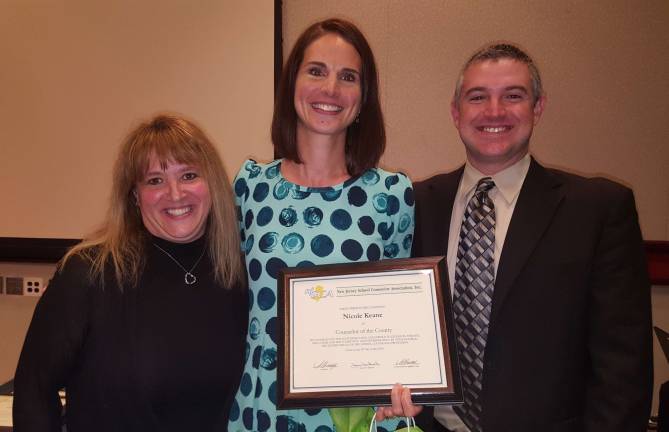 Nicole Keene, center, is shown with Timothy Conway, right, president of the N.J. School Counselor's Association and Kristina Krops, left, Walnut Ridge Primary School reading specialist.
