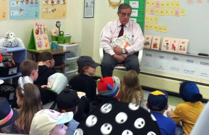 Vernon Township Mayor Victor Marotta reads to students at Cedar Mountain Primary School.