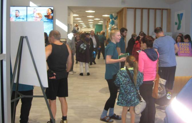 PHOTOS BY JANET REDYKEThe lobby of the Sussex County YMCA is crowded with visitors celebrating the Y&#x2019;s Open House expansion on Jan. 13.