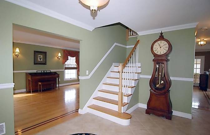 Spacious center hall colonial has in-ground pool