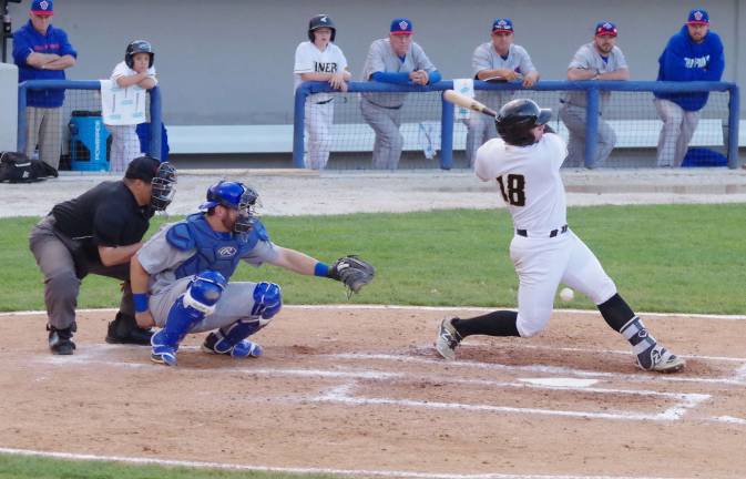 After being hit the ball moves between the legs of Sussex batter Nate Irving and into foul territory in the second inning.