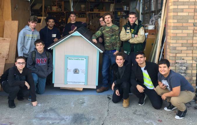 Mr. Wagner's Building Trades class at Sussex Tech in Sparta always extend a helping hand with building things for the community. Here are the students in a picture with the B.A.R.K.S. Donation Box they constructed. When Darlene reached out to them requesting a new one to replace the one they already had that was falling apart, Mr. Wagner immediately agreed and put it into his curriculum. Students not pictured are those from Graphics Design that made the lovely banner!