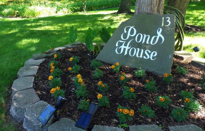 Appropriately named the Pond House, the pond in front of the home of John and Camille Westermajer includes the reflections of hundreds of tiger lilies surrounding the pond in front of their home.