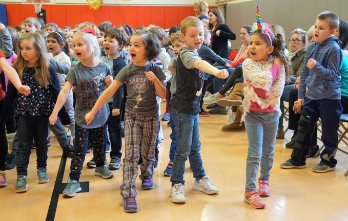 PHOTO BY VERA OLINSKI Cedar Mountain Kindergarten students yell, &quot;Kiai!&quot; while practicing a fun low block.