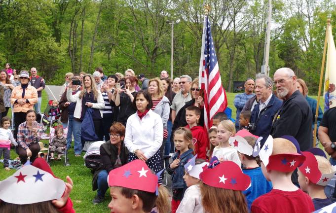 Veterans gathered around the American and New Jersey state flags.