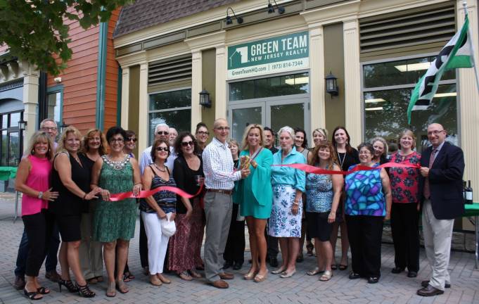 Owner Geoff Green and equity partner Kim Lasalandra (center) and their team of real estate brokers and salespeople are joined by Vernon Mayor Harry Shortway (far right) and members of the Warwick Valley , Vernon and Sussex County Chambers on Sept. 8 to celebrate the Grand Opening of the Green Team New Jersey Realty office.