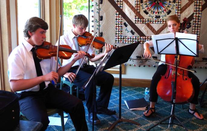 A string ensemble provided classical music for the evening. From the left are Alexander Gaura, Trevor Hazell, and Victoria Menenes.