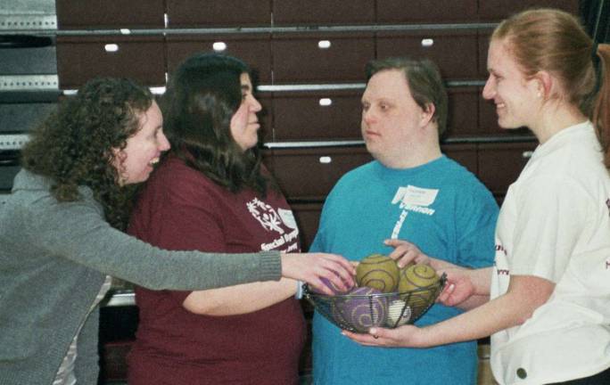 Among those on hand at the Area 3 Special Olympics Bocce Meet at Madison High School are, from left, Special Olympics volunteer Julia Bresinger, and Special Olympics athletes Melanie Havrick and Glenn Heller, all of Vernon, and Special Olympics volunteer Erin Berger of Madison.