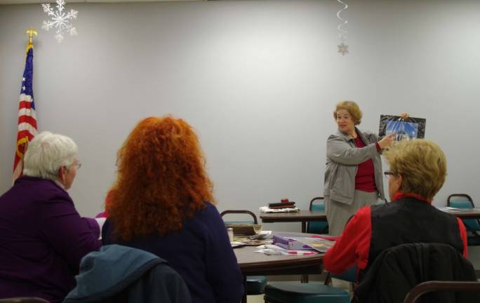 Vernon Camera Club members discuss their photographs during the latter portion of the meeting. Each month there is a different photo assignment to share with the club&#x2019;s membership.