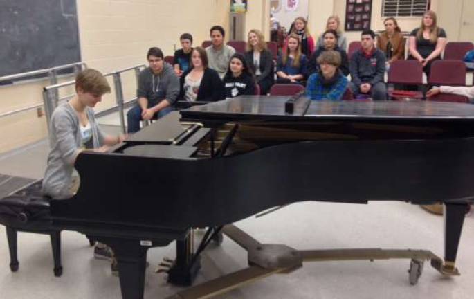 High Point Regional High School student Becky Turro for classmates in the High Point Chorus Room.