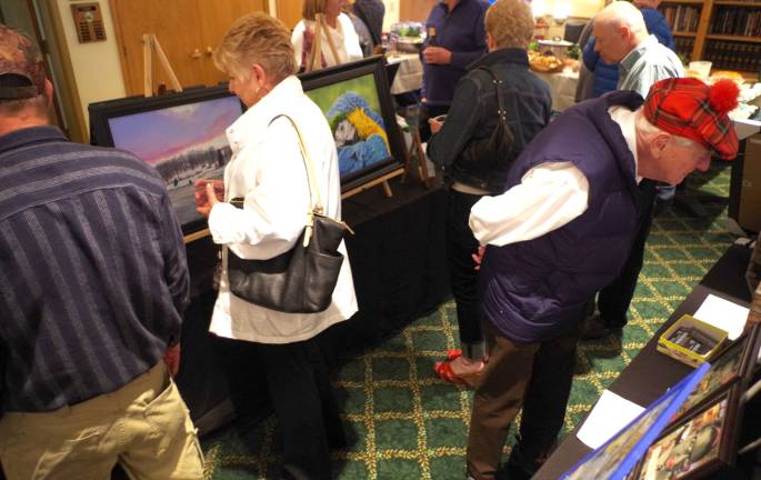 &quot;An Eclectic Evening of the Arts&quot; drew about 100 people to the Highland Lakes Country Club to peruse the diverse artwork on display.