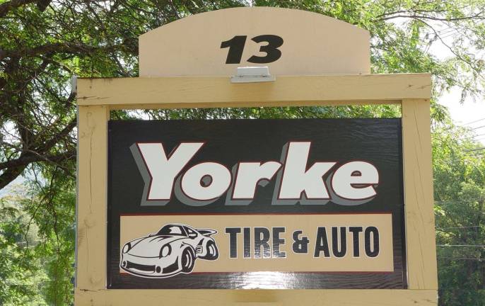 The sign to look for at 13 Vernon Crossing Road to find the Yorke Tire &amp; Auto Center